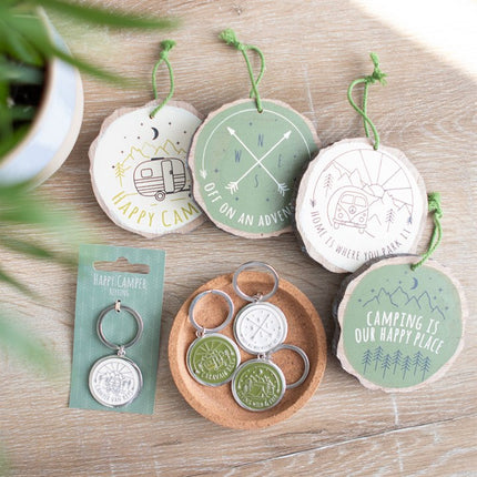 Set of 16 Happy Camper Wood Slice Signs on Display